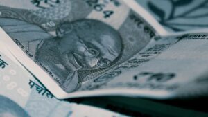 Rupee gains against dollar